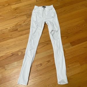 Fashion Nova ripped white stretch jeans